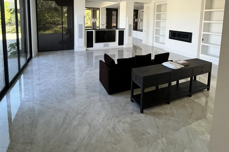 Polished Taj Mahal-look porcelain tile floor in a Palm Desert great room, installed by My-Key Tile & Flooring